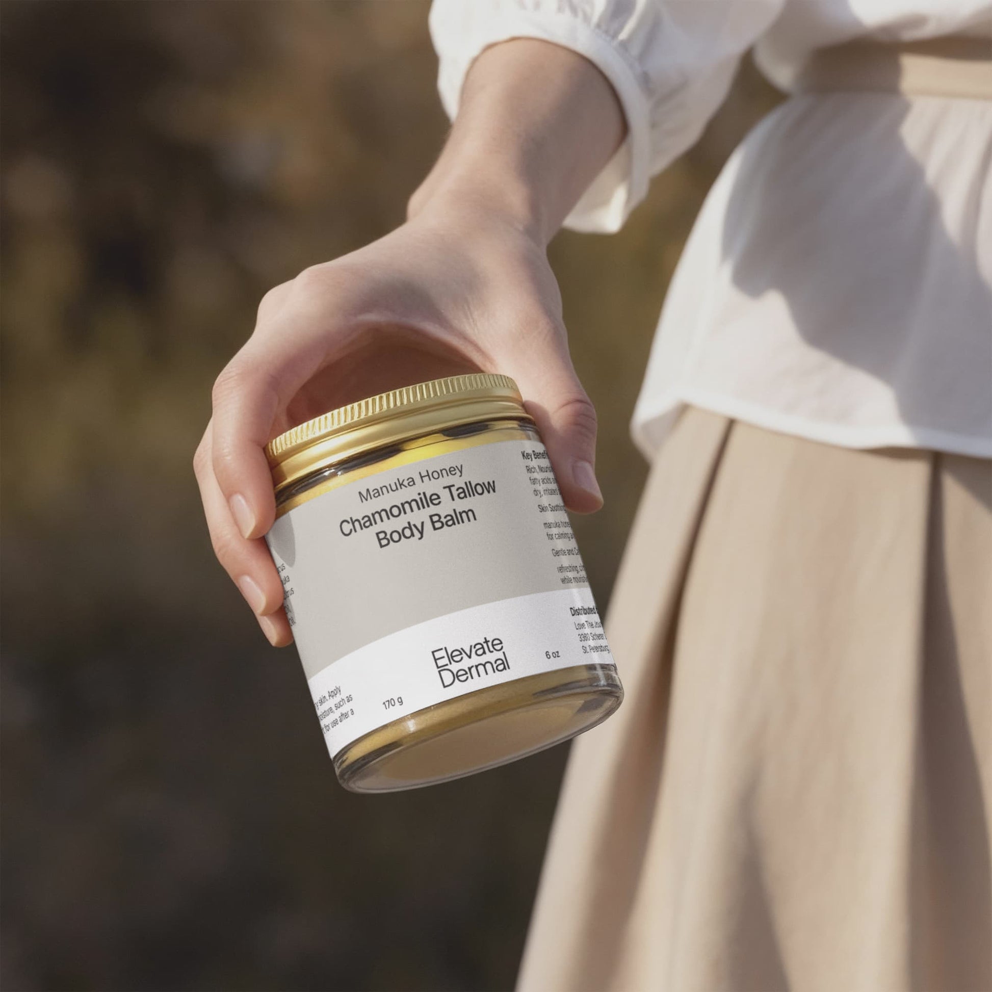 A Hand Holding Manuka Honey Chamomile Tallow Body Balm